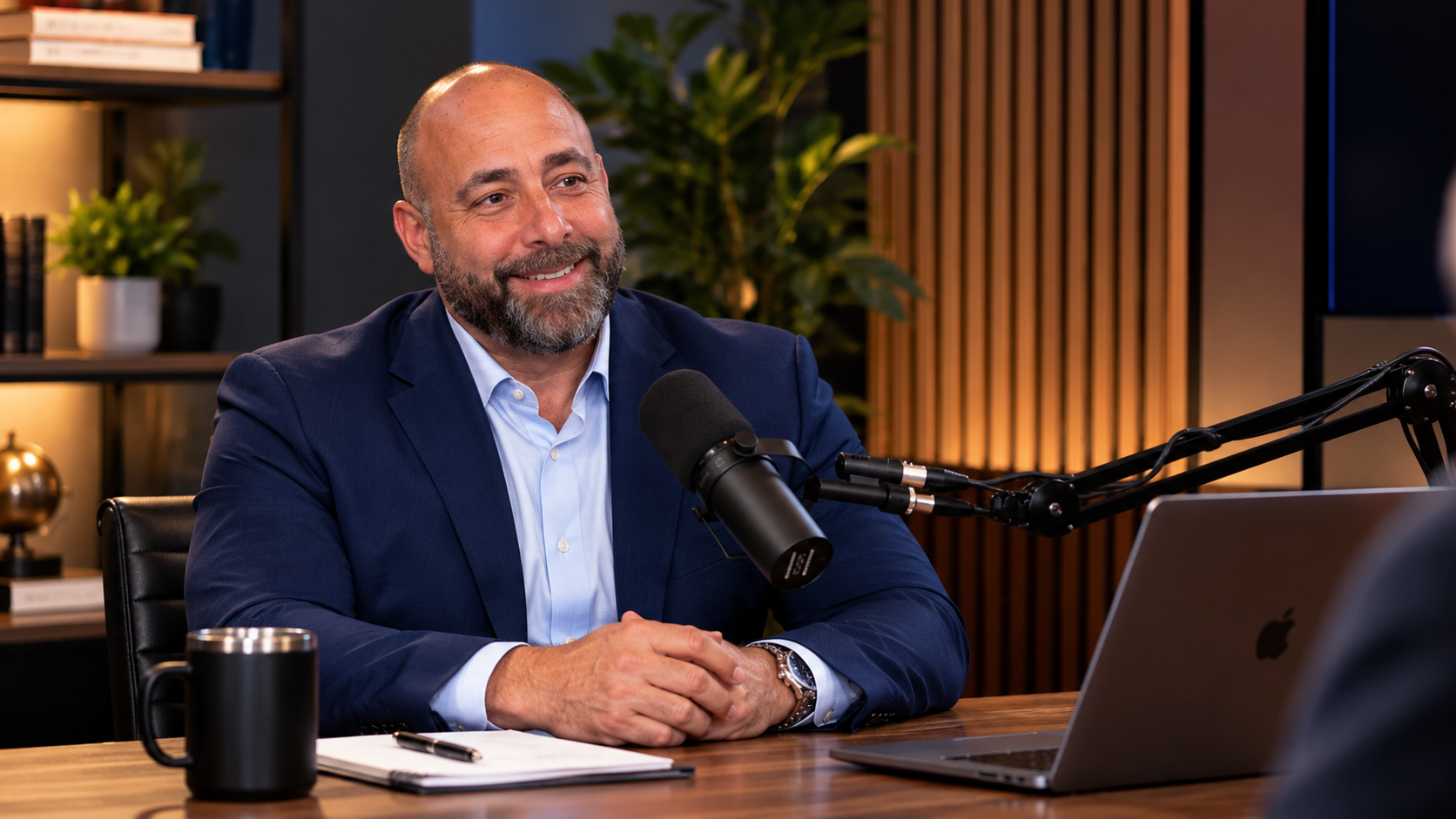 Dr. Jeff Raiffie in conversation at the podcast studio microphone