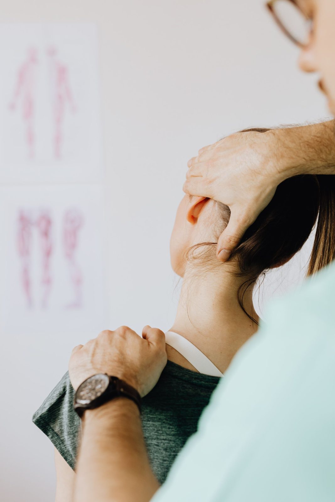 Clinician examining a patient's neck